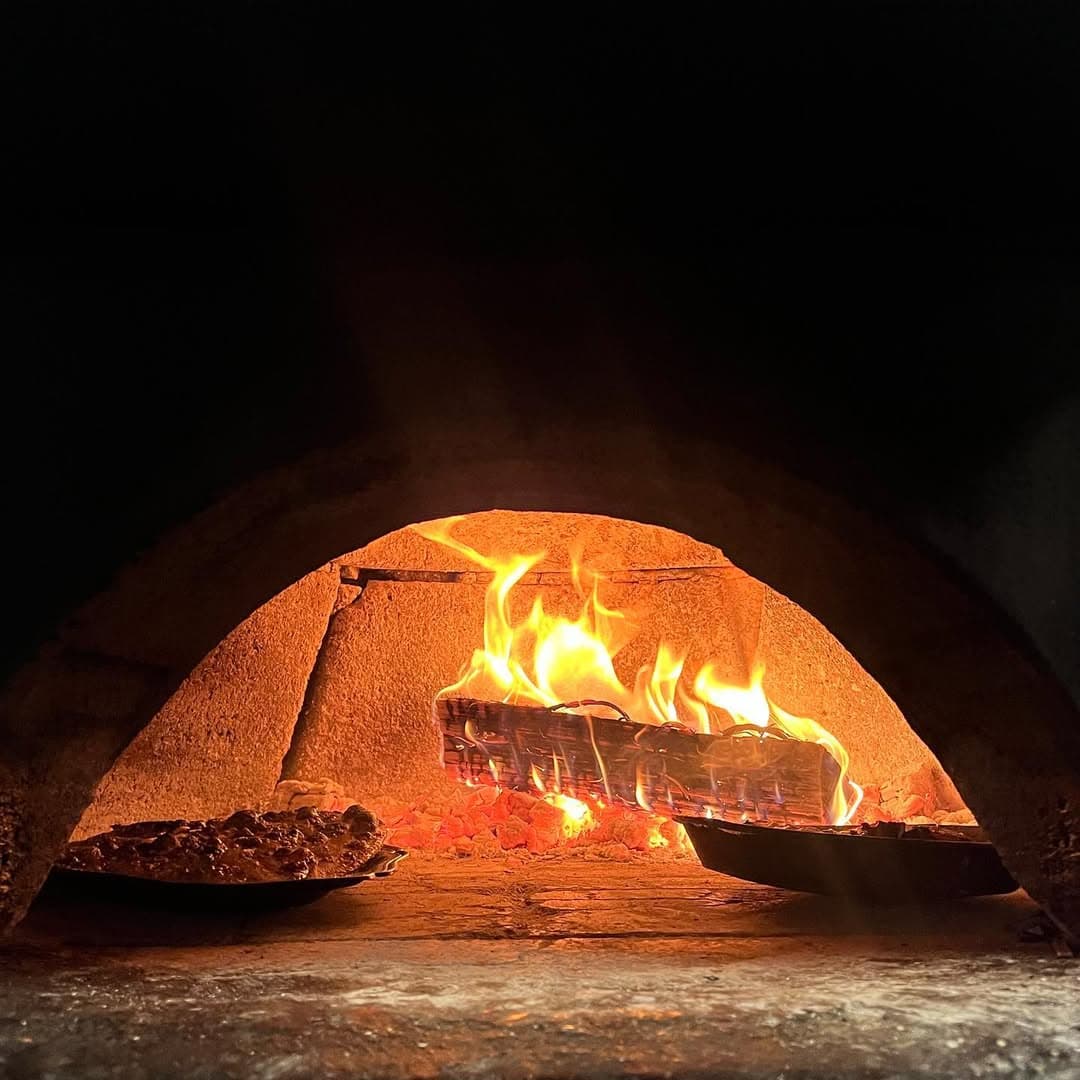 Four à bois de La Maison du Château — flammes et cuisson